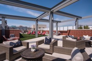 Enjoy happy hour with neighbors in our rooftop lounge. 